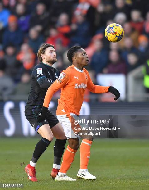 Blackpool's Karamoko Dembele battles with Charlton Athletic's Alfie May during the Sky Bet League One match between Blackpool and Charlton Athletic...