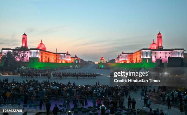 Visitors at the Vijay Chowk in the backdrop of illuminated Raisina Hill after full dress rehearsal for the upcoming Beating Retreat ceremony, on...