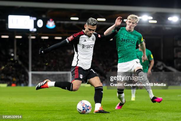 Andreas Pereira of Fulham is challenged by Anthony Gordon of Newcastle United during the Emirates FA Cup Fourth Round match between Fulham and...