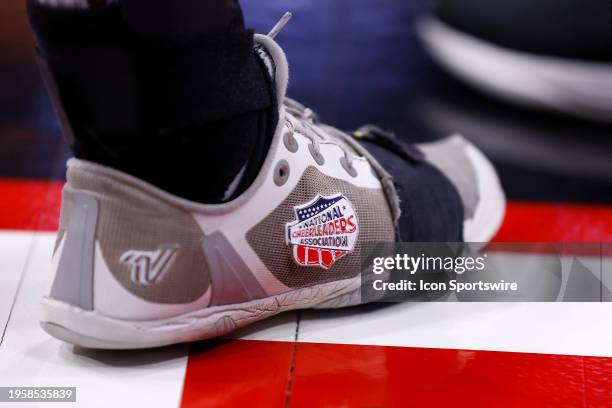 Louisville Cardinals cheerleaders shoes withe the National Cheerleaders Association logo on the side of her shoe during a mens college basketball...