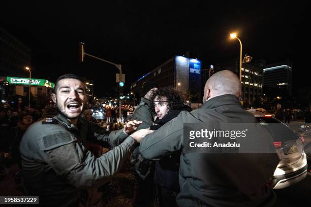 Israeli forces intervene to protesters as they gather to stage a demonstration demanding ceasefire in Gaza on January 27, 2024 in Tel Aviv, Israel.