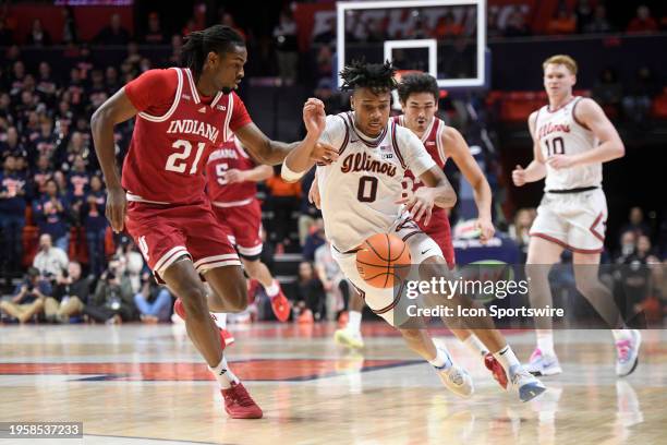 Illinois Fighting Illini Guard Terrence Shannon Jr. Dribbles as Indiana Hoosiers Forward Mackenzie Mgbako defends during the college basketball game...