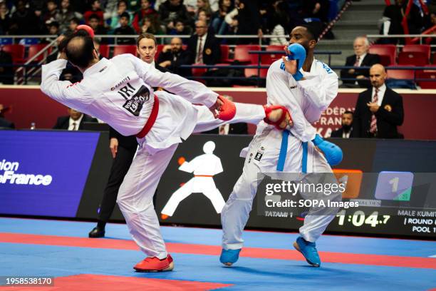 Bahman Asgari Ghoncheh from Iran and Kilian Cizo from France compete during the Male Kumite 75kg category. The Paris Open Karaté 2024, organized by...