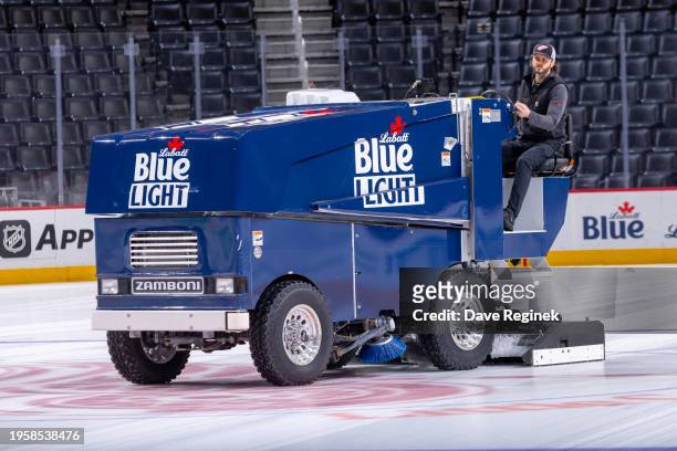 Little Caesars Arena Zamboni driver Dave Jones cleans the ice after the Detroit Pistons basketball game earlier in the day before the game between...