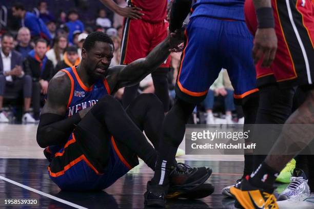 Julius Randle of the New York Knicks reacts after an injury against the Miami Heat in the second half at Madison Square Garden on January 27, 2024 in...