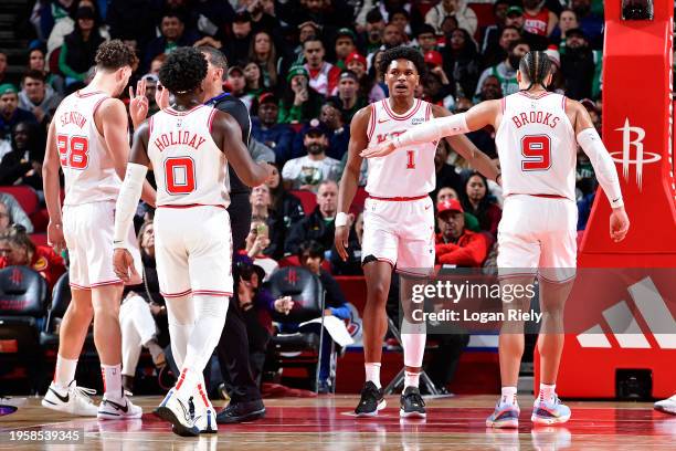 Alperen Sengun of the Houston Rockets, Aaron Holiday of the Houston Rockets, Amen Thompson of the Houston Rockets and Dillon Brooks of the Houston...