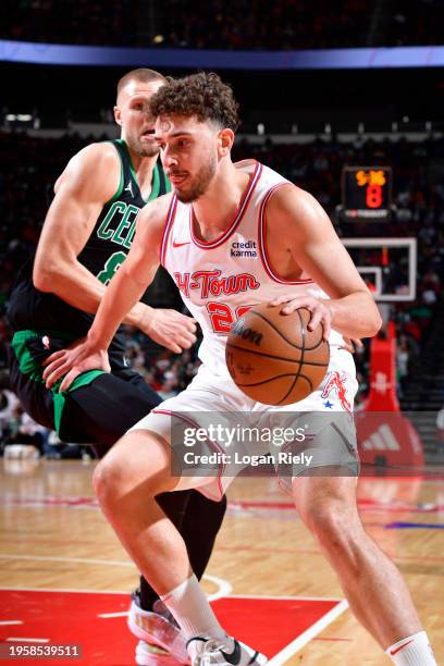 Alperen Sengun of the Houston Rockets handles the ball during the game against the Boston Celtics on January 21, 2024 at the Toyota Center in...