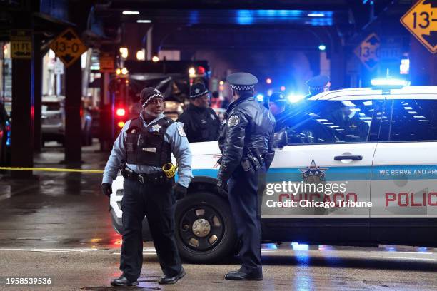 Chicago police conduct an investigation after a shooting on Wabash Avenue between Madison and Washington streets on Friday, Jan. 26 in Chicago.