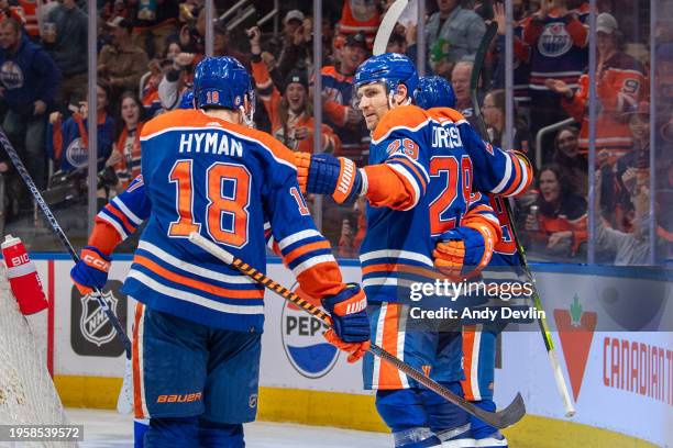 Leon Draisaitl of the Edmonton Oilers celebrates after his second period goal against the Nashville Predators with Zach Hyman and Ryan Nugent-Hopkins...