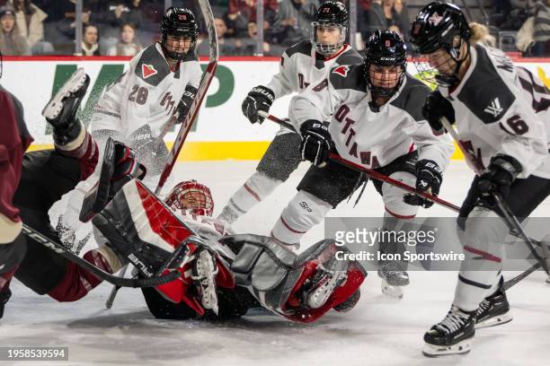Montreal forward Marie-Philip Poulin collides with Ottawa goalie Emerance Maschmeyer during the second period of the PWHL Ottawa vs Montreal game on...