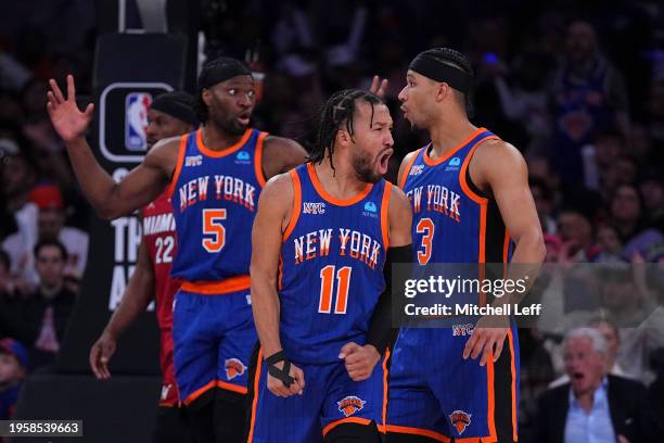 Precious Achiuwa, Jalen Brunson and Josh Hart of the New York Knicks react against the Miami Heat in the second half at Madison Square Garden on...