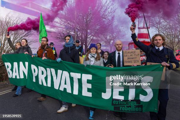 Climate activists including Greta Thunberg march to protest against private jet flights and the proposed expansion of Farnborough Airport on 27th...