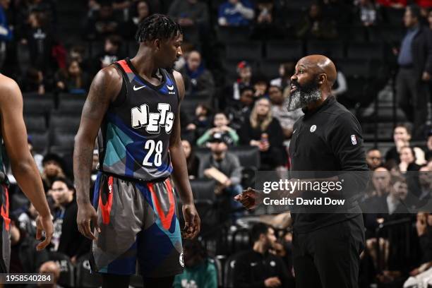 Dorian Finney-Smith talks to Jacque Vaughn of the Brooklyn Nets during the game against the Houston Rockets on January 27, 2024 at Barclays Center in...