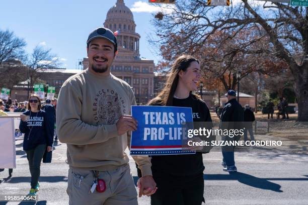 Anti-abortion rights supporters take part in a "Rally for Life" march and celebration outside the Texas State Capitol on January 27 in Austin, Texas....