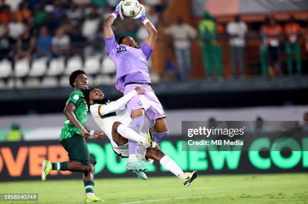 Stanley Nwabali of Nigeria competes for the ball with Georges-Kévin N'Koudou of Cameroon ,during the Total Energies CAF Africa Cup of Nations round...