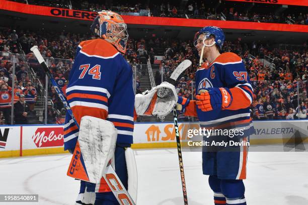 Connor McDavid and Stuart Skinner of the Edmonton Oilers celebrate after their win over the Nashville Predators at Rogers Place on January 27 in...