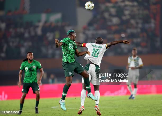 Kenneth Omeruo of Nigeria heads the ball against Vincent Aboubakar of Cameroon ,during the Total Energies CAF Africa Cup of Nations round of 16 match...