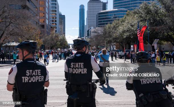 Austin state troopers watch as Anti-abortion rights supporters take part in a "Rally for Life" march and celebration outside the Texas State Capitol...
