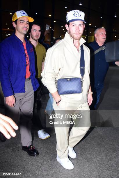 Joe Jonas, Kevin Jonas and Nick Jonas are seen arriving at Mumbai International Airport on January 26, 2024 in Mumbai, India.