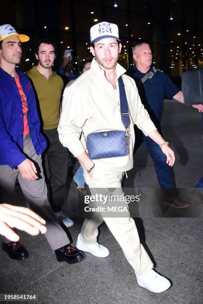 Joe Jonas, Kevin Jonas and Nick Jonas are seen arriving at Mumbai International Airport on January 26, 2024 in Mumbai, India.