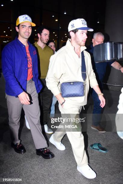 Joe Jonas, Kevin Jonas and Nick Jonas are seen arriving at Mumbai International Airport on January 26, 2024 in Mumbai, India.