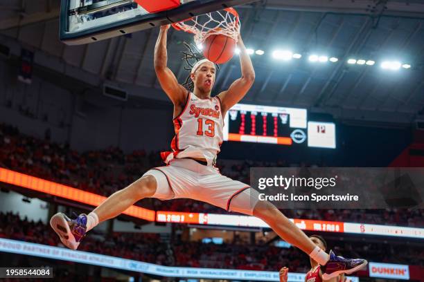 Syracuse Orange Forward Benny Williams dunks the ball during the second half of the College Basketball game between the North Carolina State Wolfpack...