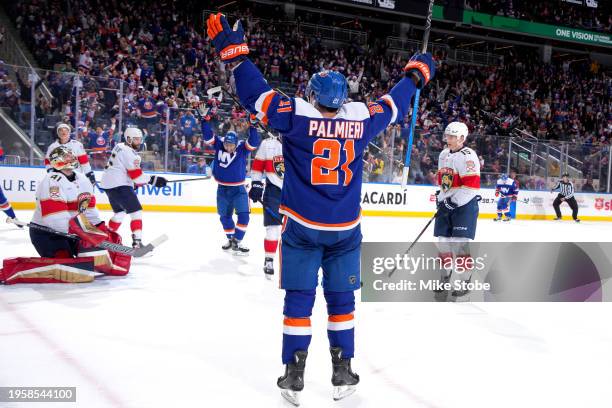 Kyle Palmieri of the New York Islanders celebrates after scoring a goal past Anthony Stolarz of the Florida Panthers during the third period at UBS...