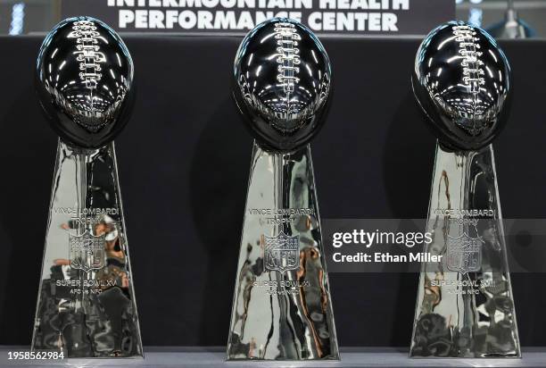 Three Vince Lombardi Trophies from Las Vegas Raiders championship wins in Super Bowls XI, XV and XVIII are displayed before a news conference...