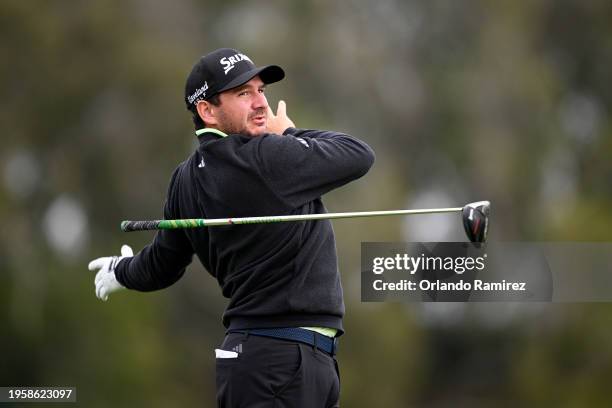 Alejandro Tosti of Argentina hits his shot from the 14th tee during the first round of the Farmers Insurance Open on the Torrey Pines North Course on...