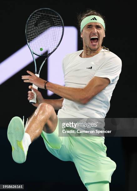 Alexander Zverev of Germany celebrates match point in their quarterfinals singles match against Carlos Alcaraz of Spain during the 2024 Australian...