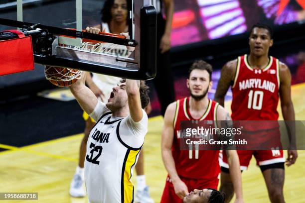 Owen Freeman of the Iowa Hawkeyes dunks the ball during the first half against the Maryland Terrapins at Carver-Hawkeye Arena on January 24, 2024 in...