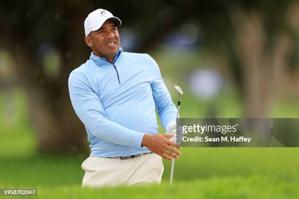 Jhonattan Vegas of Venezuela hits his shot from a bunker on the sixth hole during the first round of the Farmers Insurance Open on the Torrey Pines...