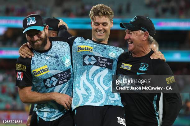 Michael Neser, Andy Bichel and Spencer Johnson of the Heat celebrate victory during the BBL Final match between Sydney Sixers and Brisbane Heat at...