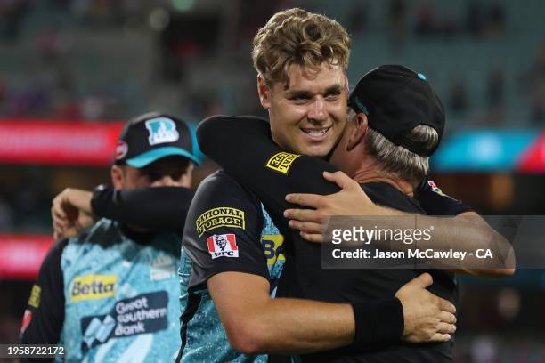 Andy Bichel and Spencer Johnson of the Heat celebrate victory during the BBL Final match between Sydney Sixers and Brisbane Heat at Sydney Cricket...