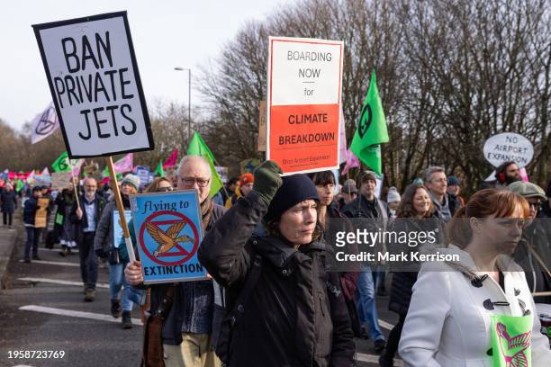 Climate activists march to protest against private jet flights and the proposed expansion of Farnborough Airport on 27th January 2024 in Farnborough,...