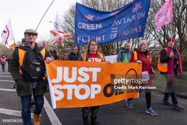 Climate activists from Just Stop Oil march to protest against private jet flights and the proposed expansion of Farnborough Airport on 27th January...