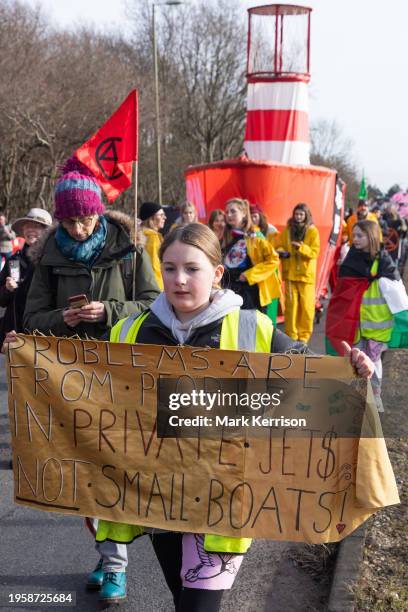 Climate activists march to protest against private jet flights and the proposed expansion of Farnborough Airport on 27th January 2024 in Farnborough,...