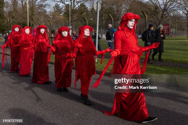 Extinction Rebellion Red Rebels join climate activists protesting against private jet flights and the proposed expansion of Farnborough Airport on...