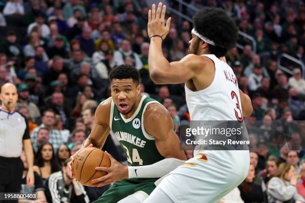 Giannis Antetokounmpo of the Milwaukee Bucks drives to the basket against Jarrett Allen of the Cleveland Cavaliers during the first half of a game at...