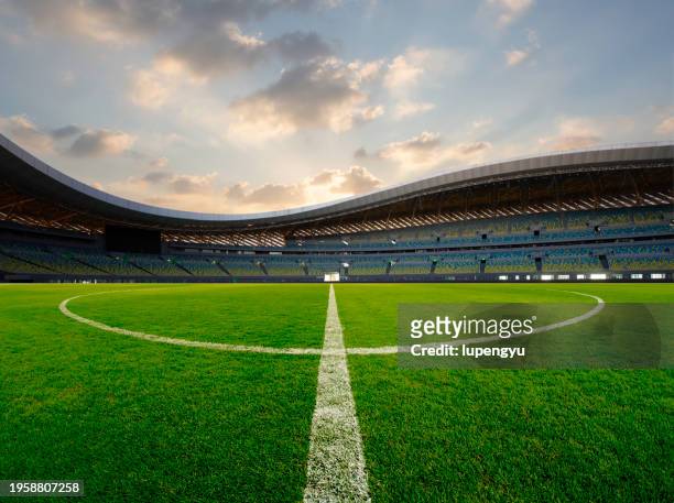 soccer field at sunset - china football stock pictures, royalty-free photos & images