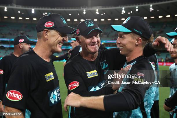 Wade Seccombe, Andy Bichel and Nathan McSweeney of the Heat celebrate victory during the BBL Final match between Sydney Sixers and Brisbane Heat at...