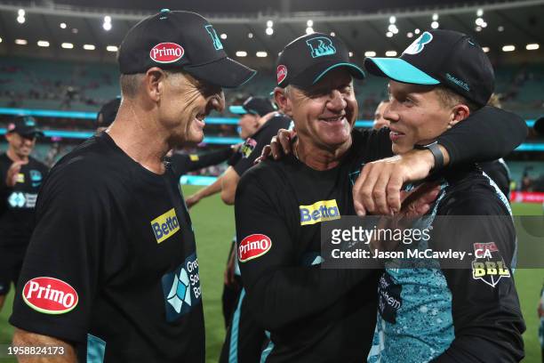 Wade Seccombe, Andy Bichel and Nathan McSweeney of the Heat celebrate victory during the BBL Final match between Sydney Sixers and Brisbane Heat at...