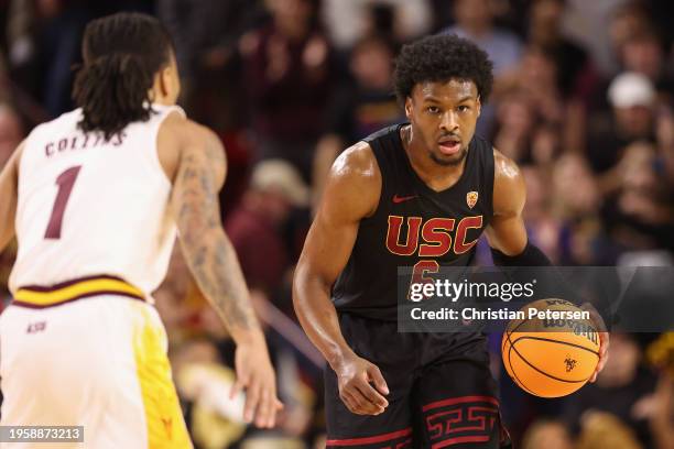 Bronny James of the USC Trojans handles the ball during the first half of the NCAAB game against the Arizona State Sun Devils at Desert Financial...