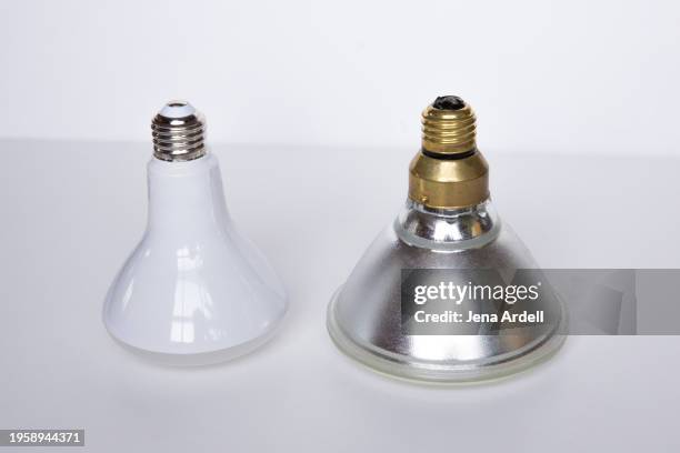 led bulb halogen light bulb comparison, energy consumption concept, light bulb ban - consumer protection stock pictures, royalty-free photos & images