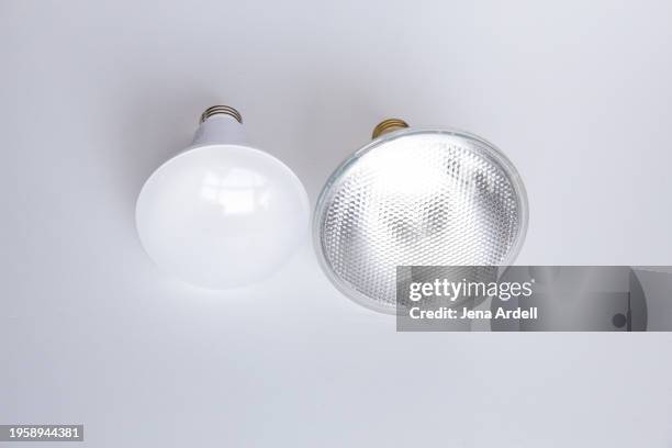 light bulb ban: led bulbs vs. halogen bulbs, energy efficiency for environment - consumer protection stock pictures, royalty-free photos & images