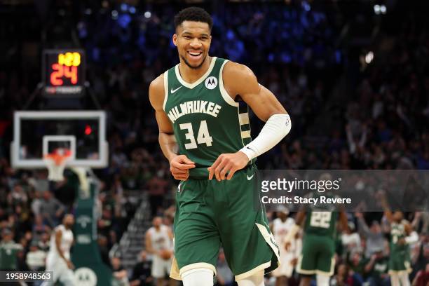 Giannis Antetokounmpo of the Milwaukee Bucks reacts to a three point shot during the second half of a game against the Cleveland Cavaliers at Fiserv...