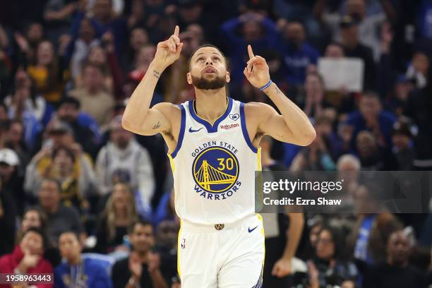 Stephen Curry of the Golden State Warriors points to the sky after making a basket in the first quarter of their game against the Atlanta Hawks on...