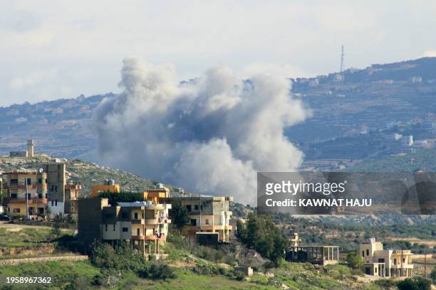 Picture taken from Lebanon's southern village of Majdelzoun shows smoke billowing during an Israeli air strike on its outskirts towards Zibqin...