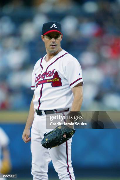 Greg Maddux of the Atlanta Braves stands on the mound during the game against the Philadelphia Phillies at Turner Field on April 18, 2002 in Atlanta,...