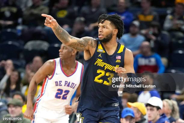 David Joplin of the Marquette Golden Eagles celebrates a shot in the second half during a college basketball game against the DePaul Blue Demons at...